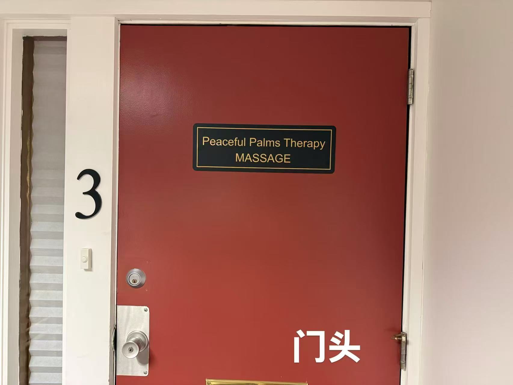 The red entrance door of Peaceful Palms Therapy with its brass nameplate at Unit 3